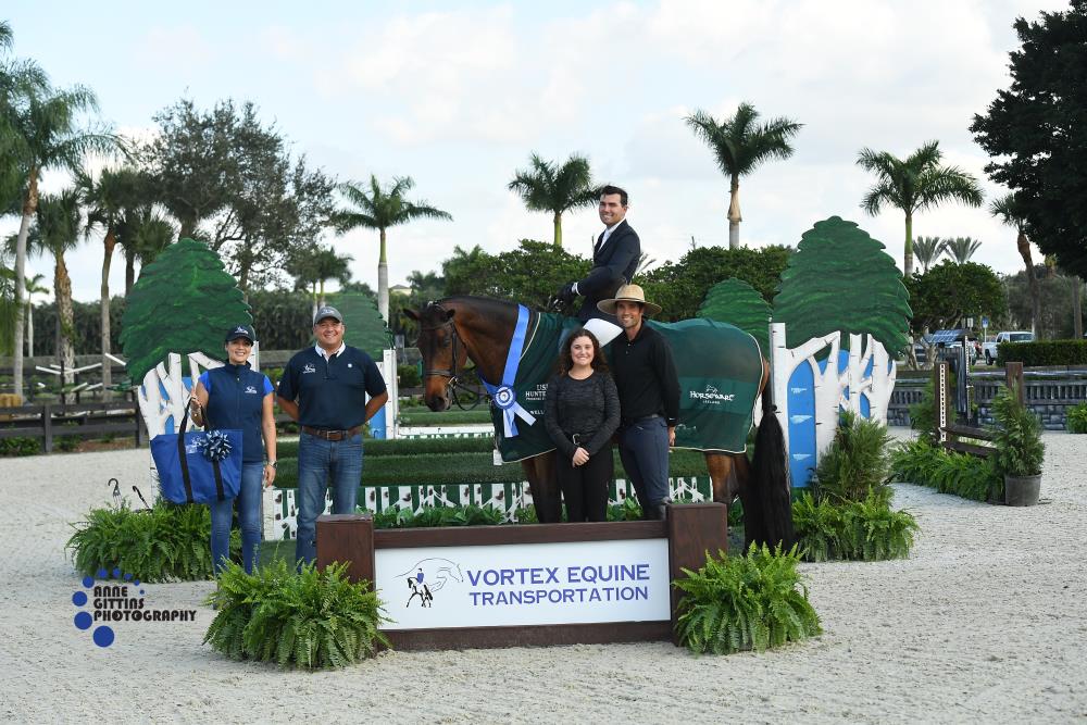 Geoffrey Hesslink and Mon Tresor in their presentation ceremony. Pictured with Juan Botero, Owner of Vortex Equine Transportation, Ana Maria Fernandez, Vortex Equine Transport, and company. ©Anne Gittins Photography