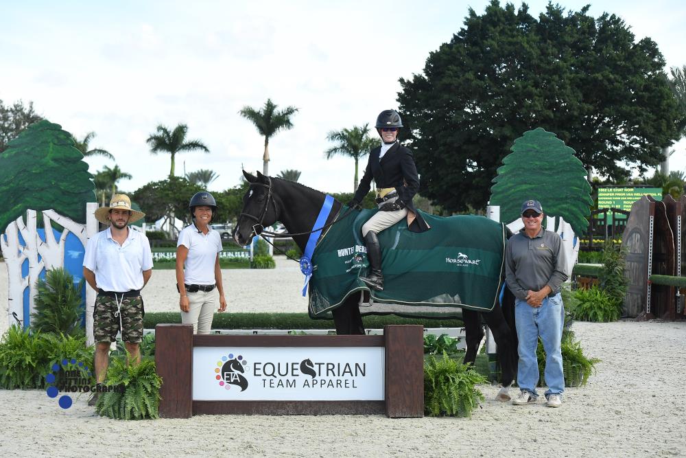 Jennifer Prior won the  $1,000 2'6"/2'9" Hunter Derby, presented by Equestrian Team Apparel. Pictured with Kim Farlinger, Tommy Skiffington, and Thomas Skiffington. ©Anne Gittins Photography 