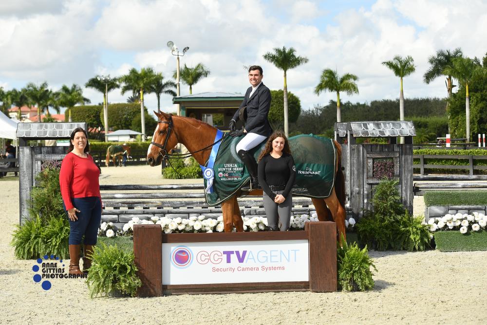 Geoffrey Hesslink and Chivalry, pictured with Lauren Little and Tatiana Yaques, CEO of CCTV Agent, won the $10,000 USHJA National Hunter Derby, presented by CCTV Agent. ©Anne Gittins Photography
