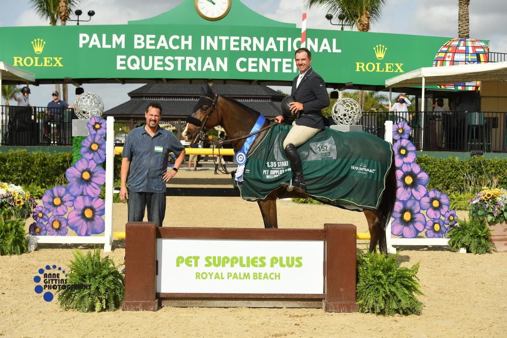 Alex Granato and Disco Superfly, pictured with  Jim Beauchamp, Owner of Pet Supplies Plus Royal Palm Beach, topped the $5,000 Pet Supplies Plus 1.35m Stake. ©Anne Gittins Photography