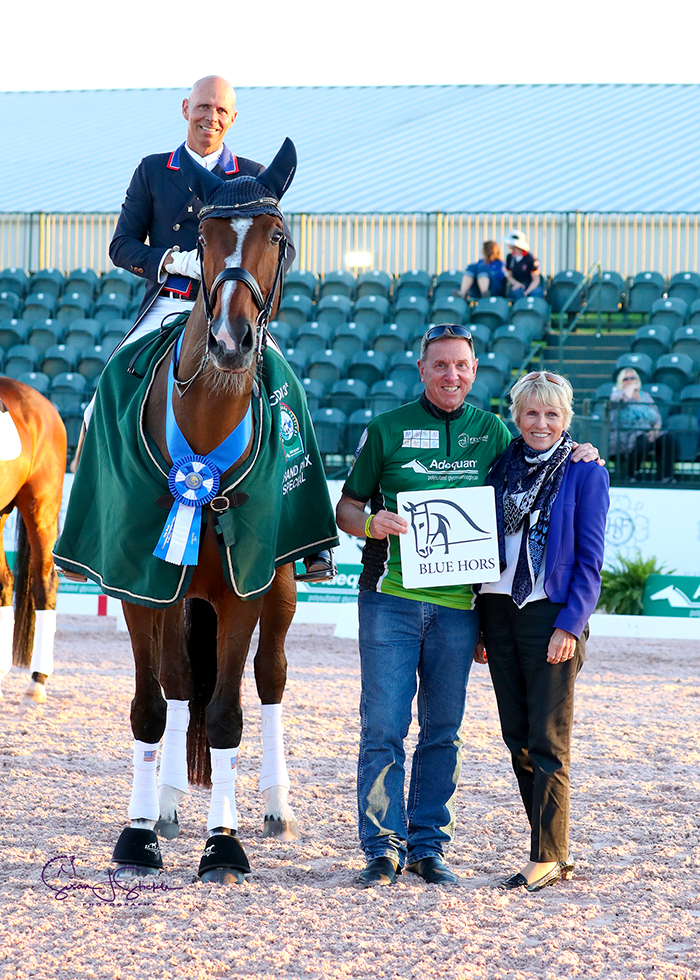 Steffen Peters in the prize-giving with Allyn Mann of Adequan® and judge at C, Germany's Katrina Wuest. ©️Susan Stickle.
