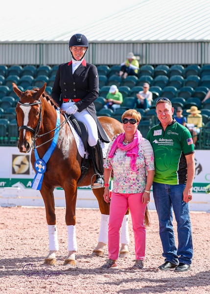 Croatia's Karen Pavicic and the Totilas son Totem with judge Elizabeth (Sissy) Max-Theurer and Allyn Mann of title sponsor Adequan®. ©️Susan Stickle.