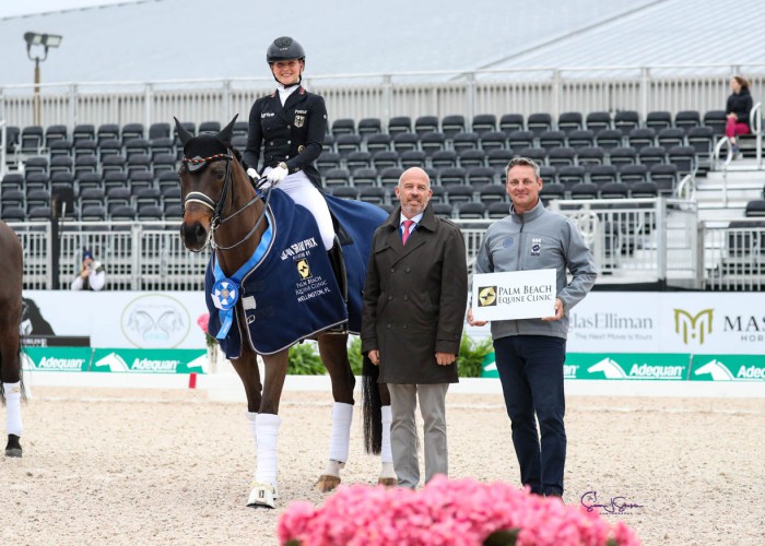 Felicitas Hendricks & Drombusch OLD presented as winners of the FEI World Cup™ Grand Prix by judge at C Peter Storr and Dr. Bryan Dubynsky, DVM of Palm Beach Equine Clinic. Photo © SusanJStickle.com