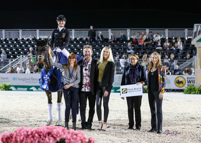 Felicitas Hendricks & Drombusch OLD with groom Lauren McNabb presented as winners of the World Cup™ Grand Prix Freestyle, presented by Palm Beach Equine Clinic, by (left to right) Dr. Scott Swerdlin, DVM, MRCVS, Amy Swerdlin, judge at C Dr. Evi Eisenhardt, and Melissa Brusie. ©susanjstickle.com
