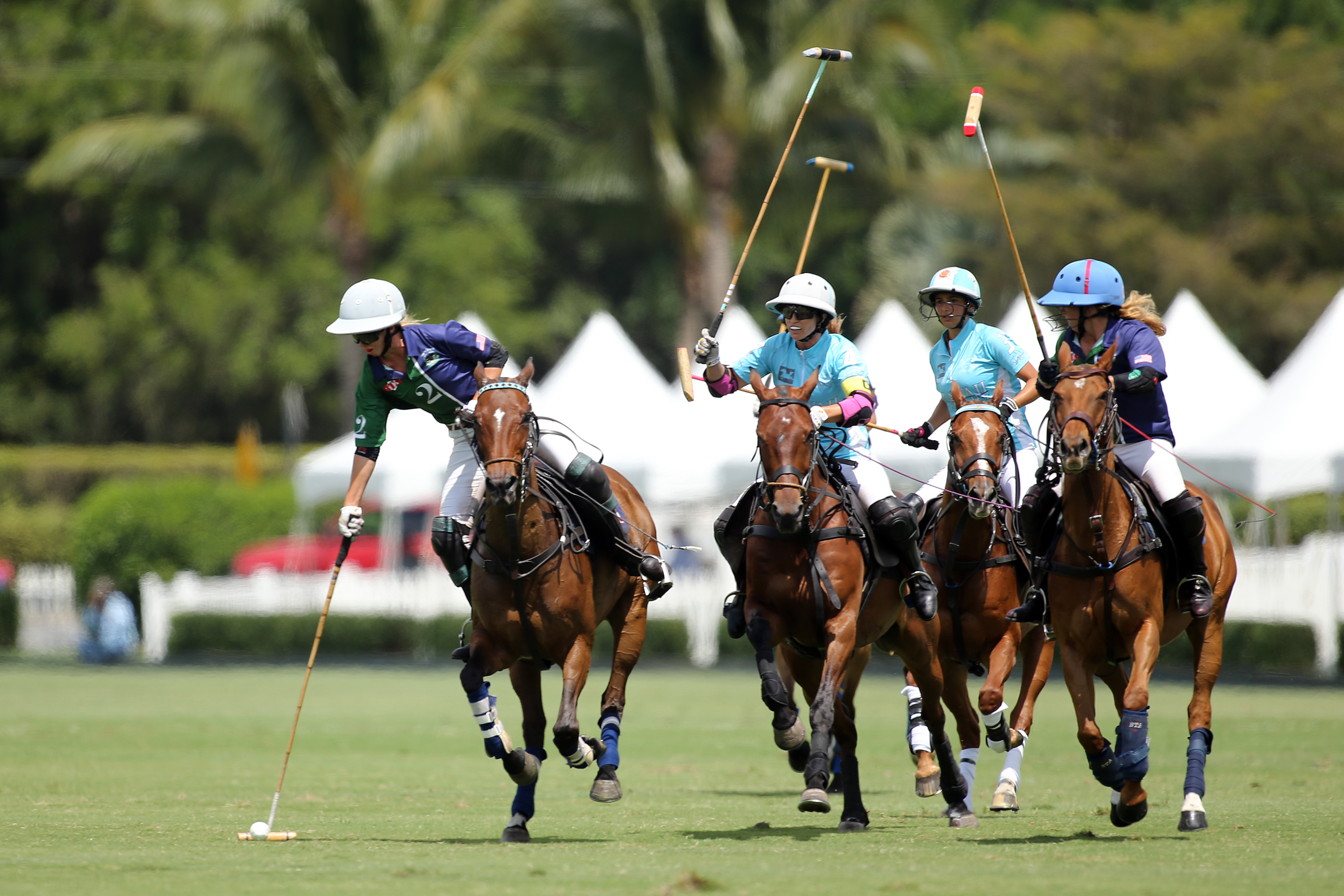 BTA The Villages' Kylie Sheehan running with the ball ahead of Hawaii Polo Life's 10-goaler Hazel Jackson. ©David Lominska