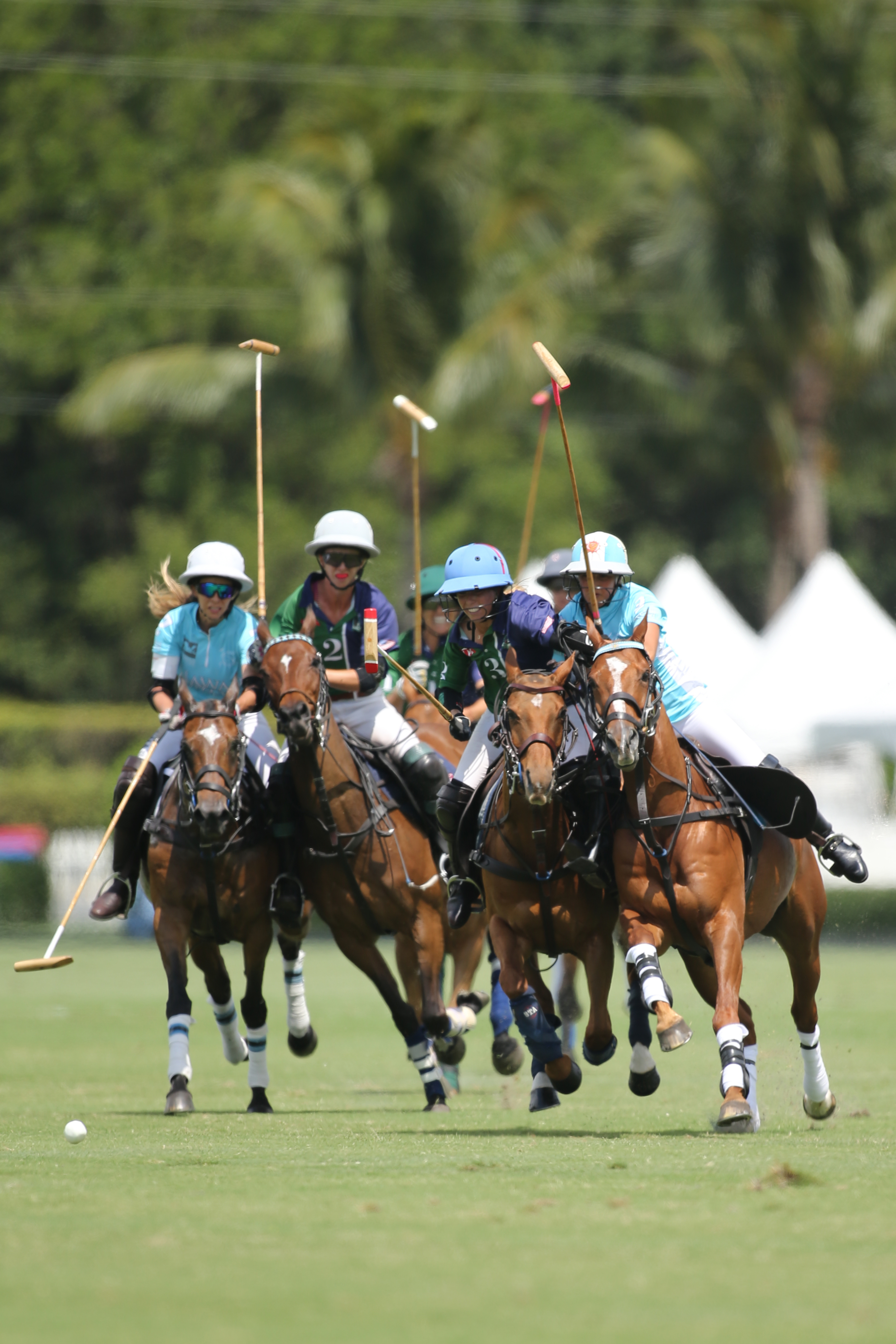 BTA The Villages' KC Krueger moves toward the ball with Hawaii Polo Life's Mia Cambiaso on her hip. ©David Lominska